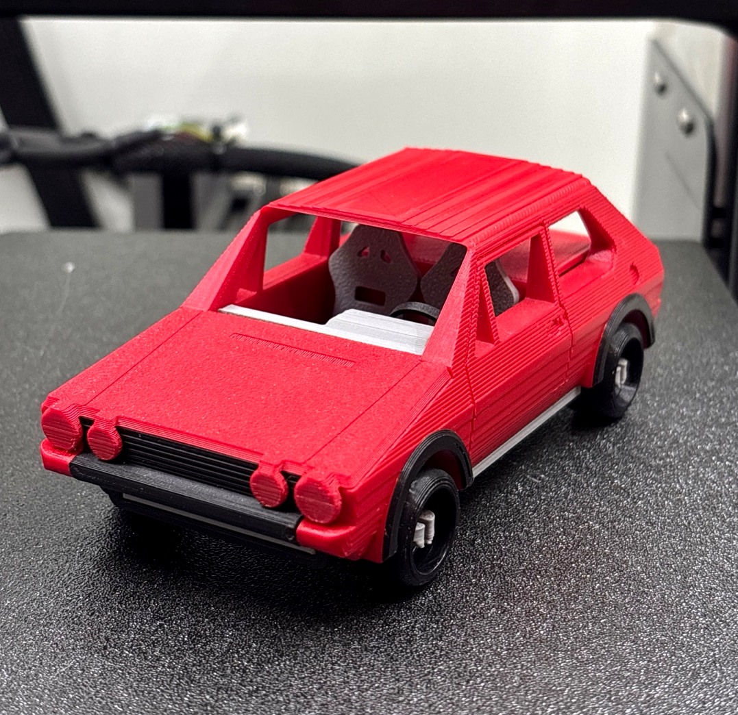 A red 3D-printed Volkswagen Golf GTI Mk1